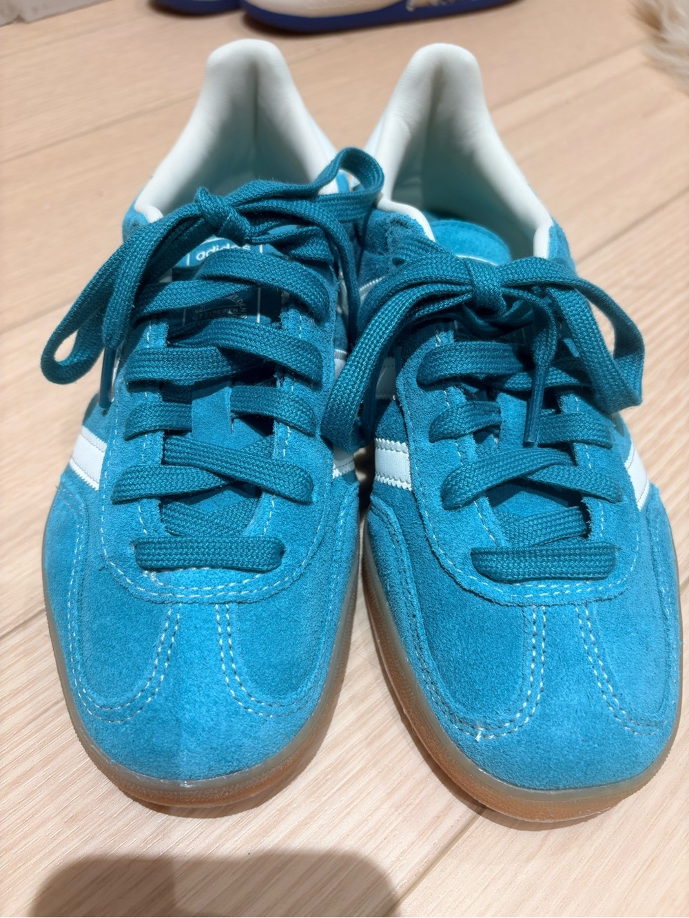 Adidas Teal Suede Athletic Shoes with White Stripe and gum bottom.